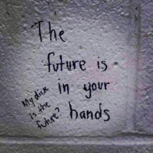 Graffiti reading the future is in your hands, with a crude reply scribbled beside it.