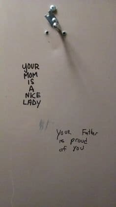Stall graffiti saying your mom is a nice lady and your father is proud.