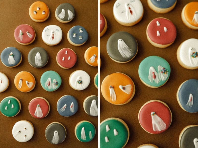 Round sugar cookies in muted colors decorated with tiny white ghosts.