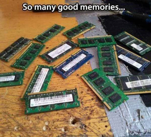 Pile of old computer RAM sticks on a workbench captioned so many good memories