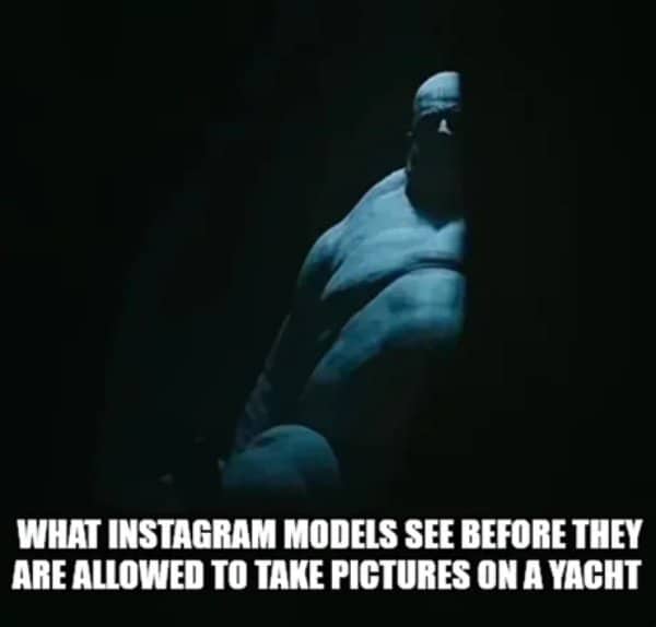 Shadowy figure of a large bald man in blue light with a yacht joke caption