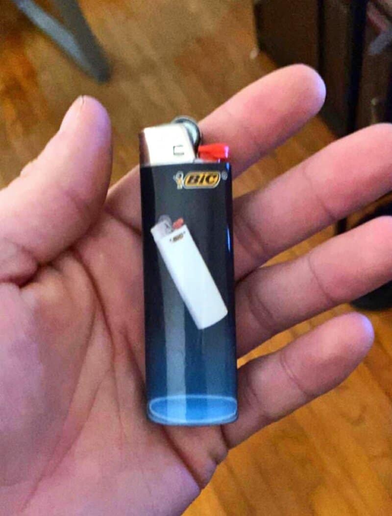BIC lighter printed with a picture of another BIC lighter on its side.