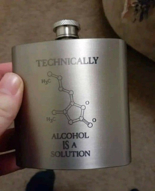 Steel flask engraved with a molecule diagram and the pun technically alcohol is a solution.