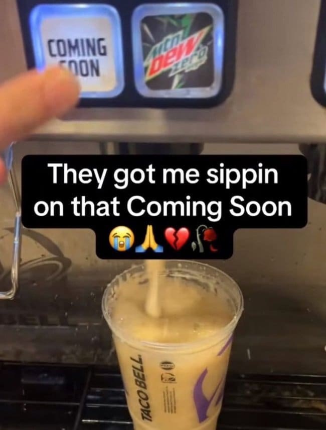 Taco Bell cup filling from a soda fountain button that only says coming soon.
