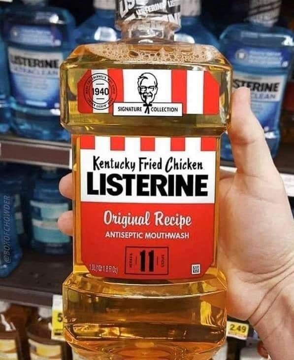 Hand holding a parody Kentucky Fried Chicken Listerine mouthwash bottle in a store aisle.