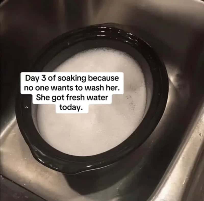 Slow cooker insert soaking in soapy water on day three because nobody wants to wash it.
