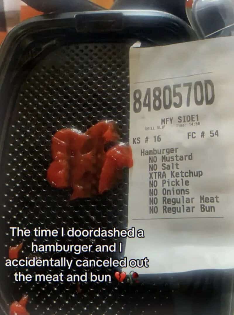 Delivery tray holding only ketchup and a receipt reading no regular meat, no regular bun.