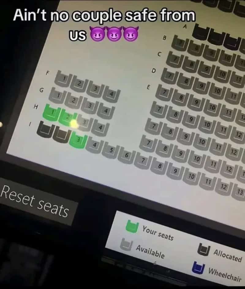 Movie theater booking screen with seats chosen to surround another couple's seats.
