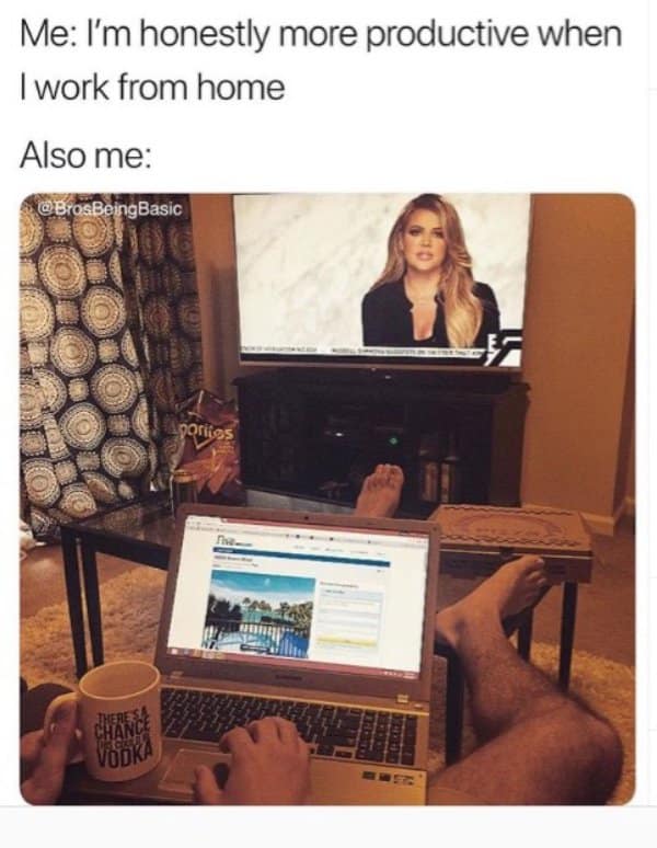 Feet up with a vodka mug and the TV on while claiming home productivity.