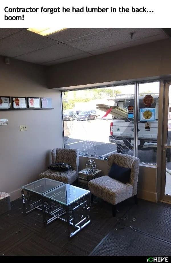 Office window shattered by lumber sticking out of a contractor's pickup truck.
