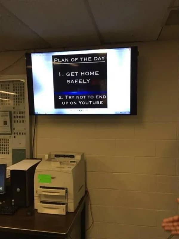 Office TV showing a plan of the day: get home safely, avoid YouTube.