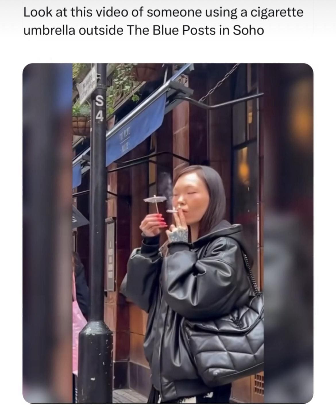 British Memes Look at this video of someone using a cigarette umbrella outside The Blue Posts in Soho