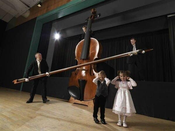 cursed instruments, instruments with threatening auras, weird instruments, instrument fails, bizarre music, odd instruments, performance art, music gadgets, funny instrument photos, experimental music, custom instruments, music humor, instrument design, odd musical gear, creepy instruments