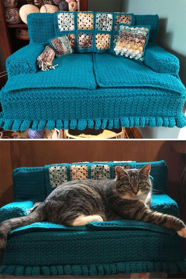 Teal crochet cat couch with throw pillows and a lounging cat
