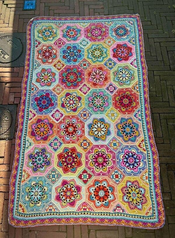 Colorful hexagon flower pattern crochet blanket outdoors