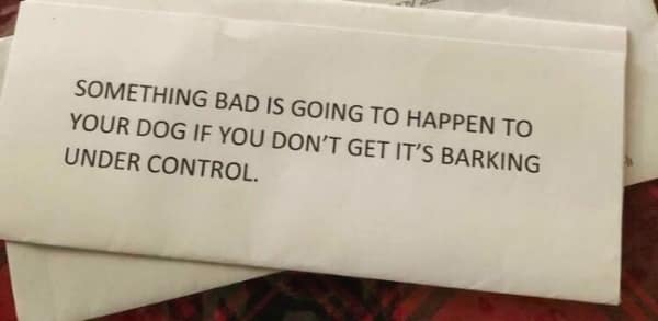 A threatening and not-so-passive aggressive neighbour note about a dog's barking problem.