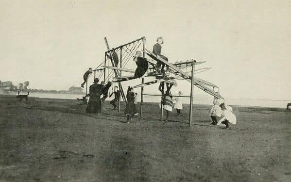 A vintage photo of a strange and very unsafe-looking jungle gym from a dangerous playground of the past.