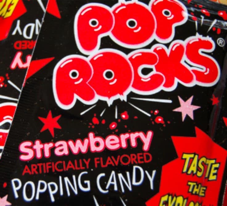 Retro packaging for Pop Rocks strawberry popping candy, a legendary piece of 80s candy history