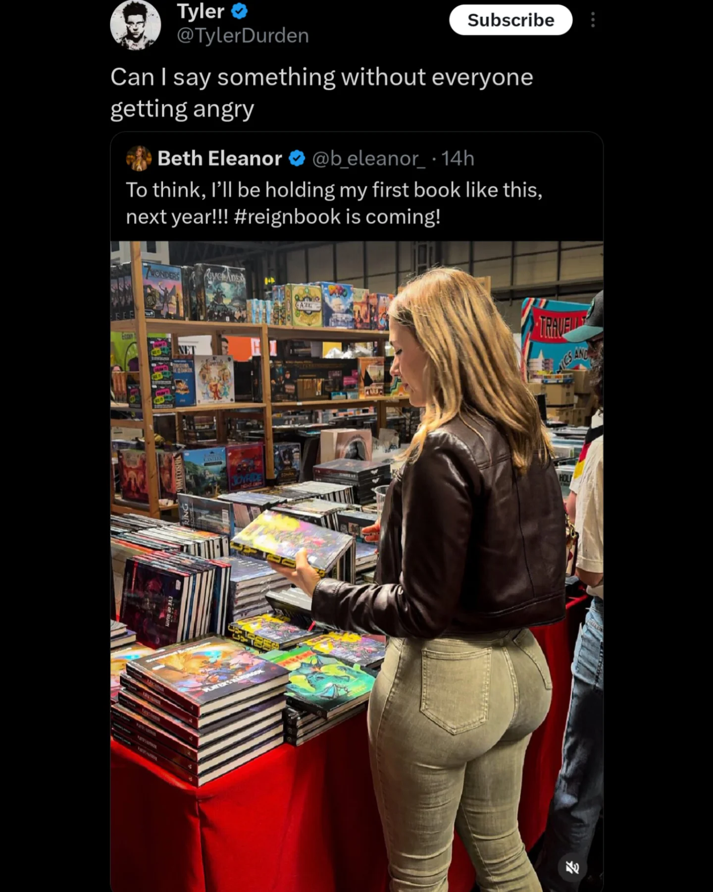 A viral tweet showing an author holding her book while a commenter asks to say something without anger.