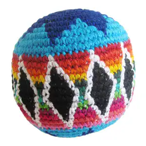 A colorful crocheted hacky sack ball with geometric patterns.