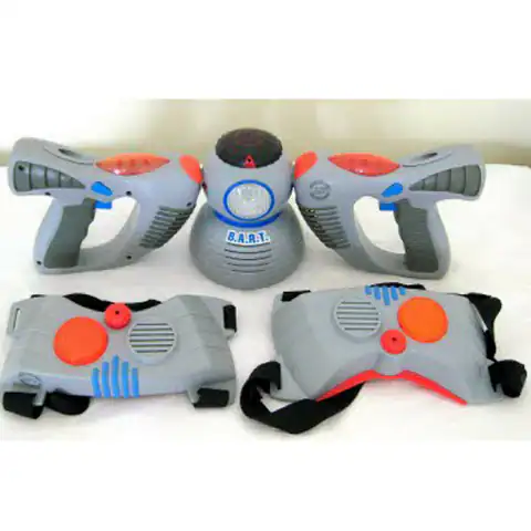 A vintage laser tag set with grey guns and a central sensor chest piece with orange accents