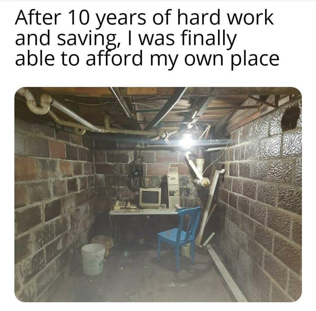 Funny real estate meme of a dingy brick basement room with an old computer and desk.