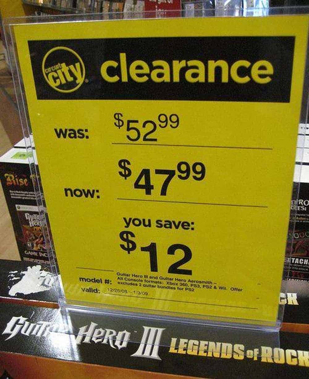 A clearance sign from Circuit City serving as a classic math fail. The sign states the original price was $52.99 and the new price is $47.99, but triumphantly claims "You Save $12" despite the actual savings being exactly five dollars.