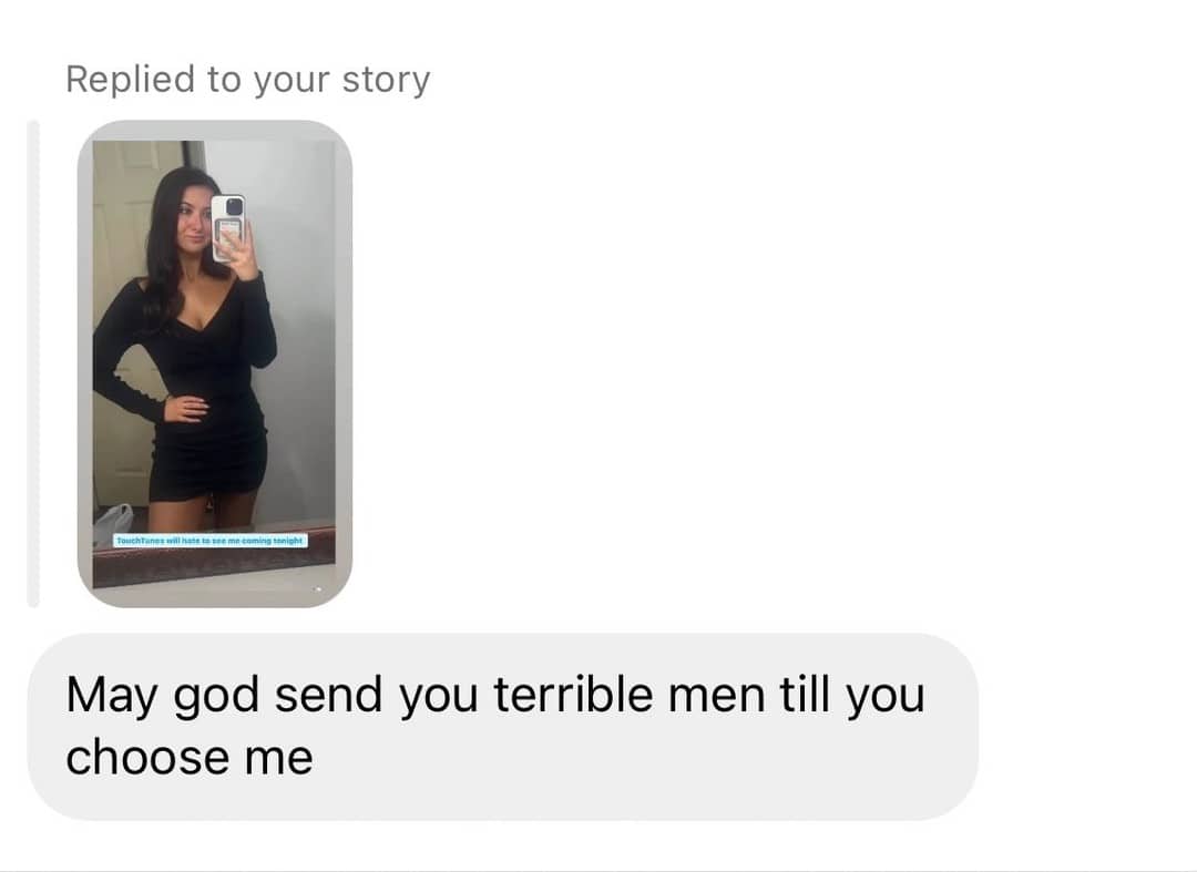 Screenshot of a woman's mirror selfie with a toxic text reply wishing her terrible men.