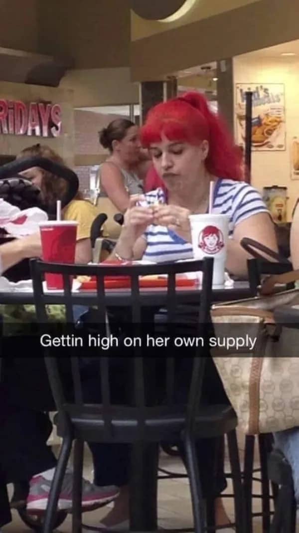 Relatable meme of a red-haired woman resembling Wendy eating fast food at a restaurant.