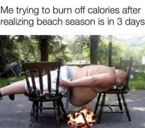 Overweight man balancing on two chairs over a small campfire to burn off stomach calories.