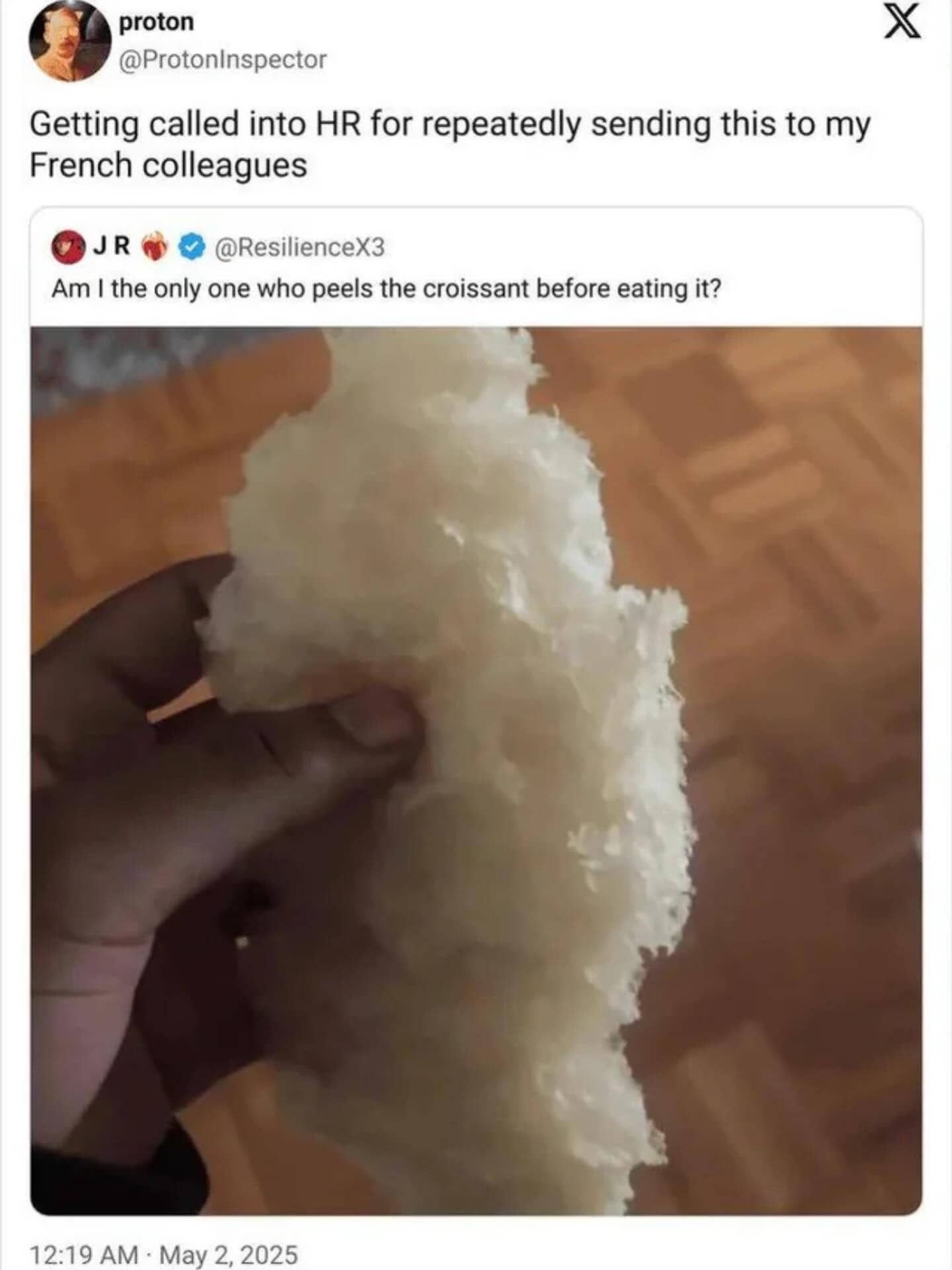 Hilarious Twitter screenshot of a hand holding an completely peeled, inner fluffy layer of a croissant.