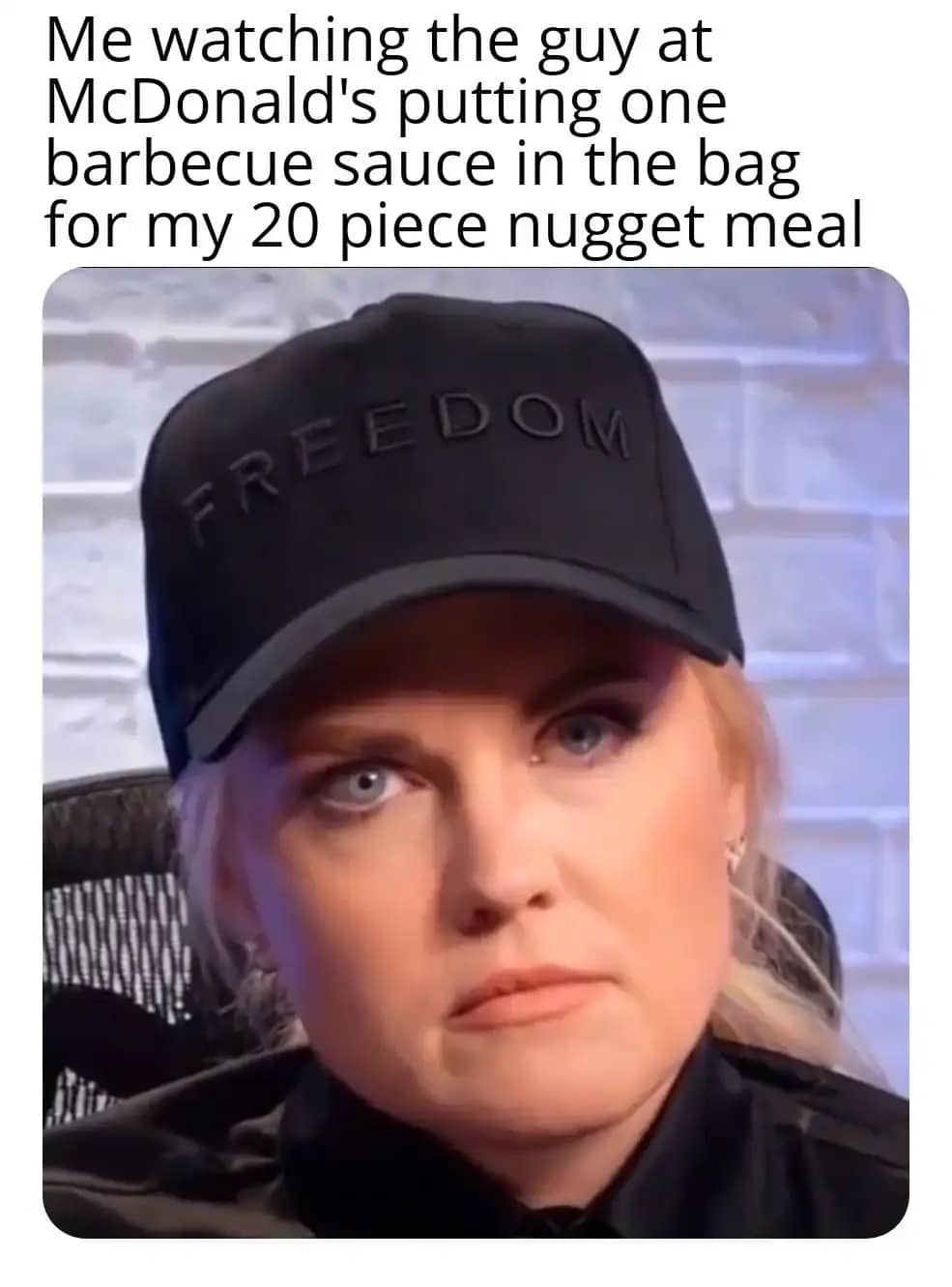 Reaction meme of a woman in a "Freedom" hat looking disappointed about insufficient barbecue sauce packets.