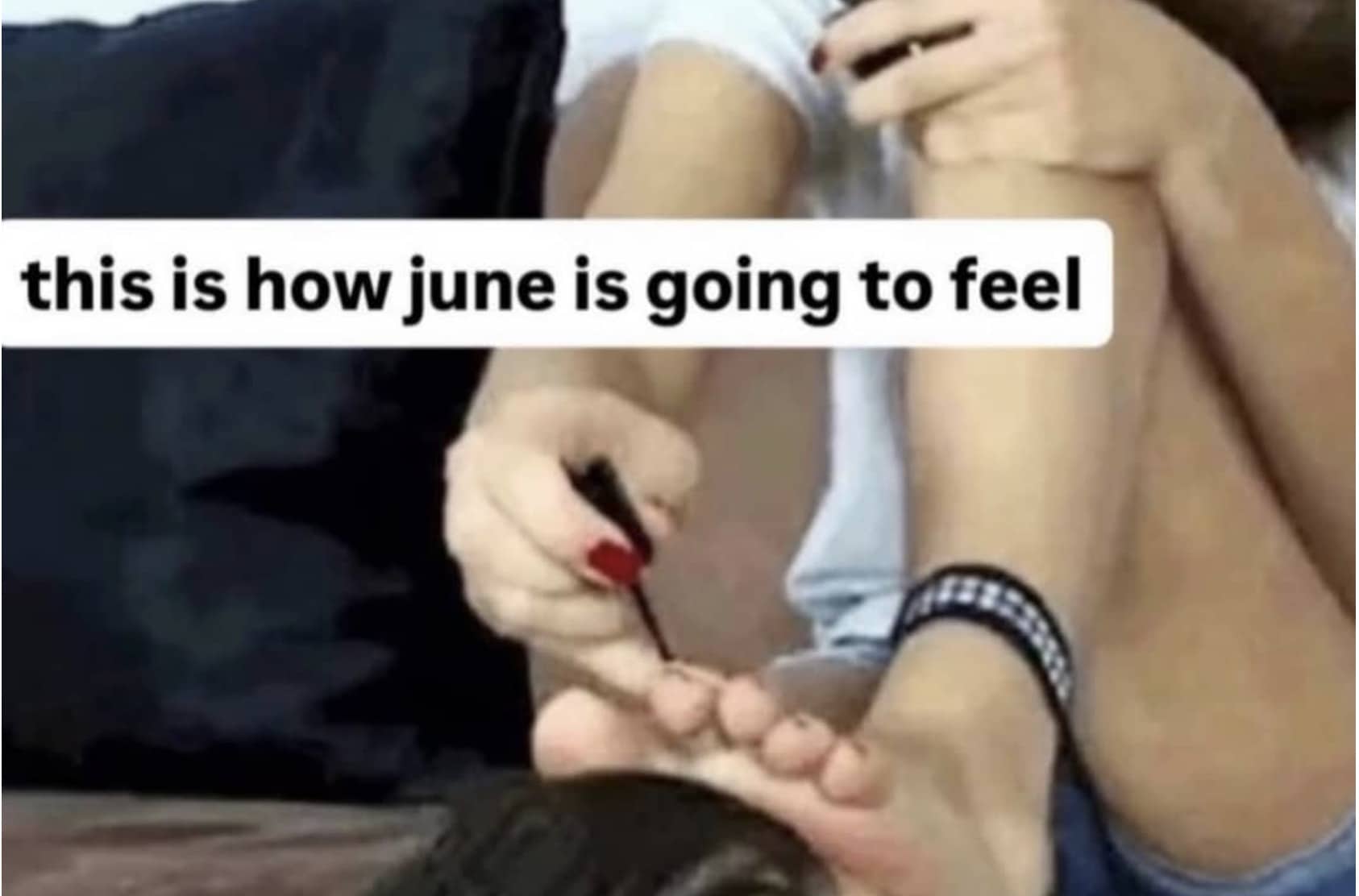 Close-up of hands applying dark nail polish to toenails, representing relatable funny memes.