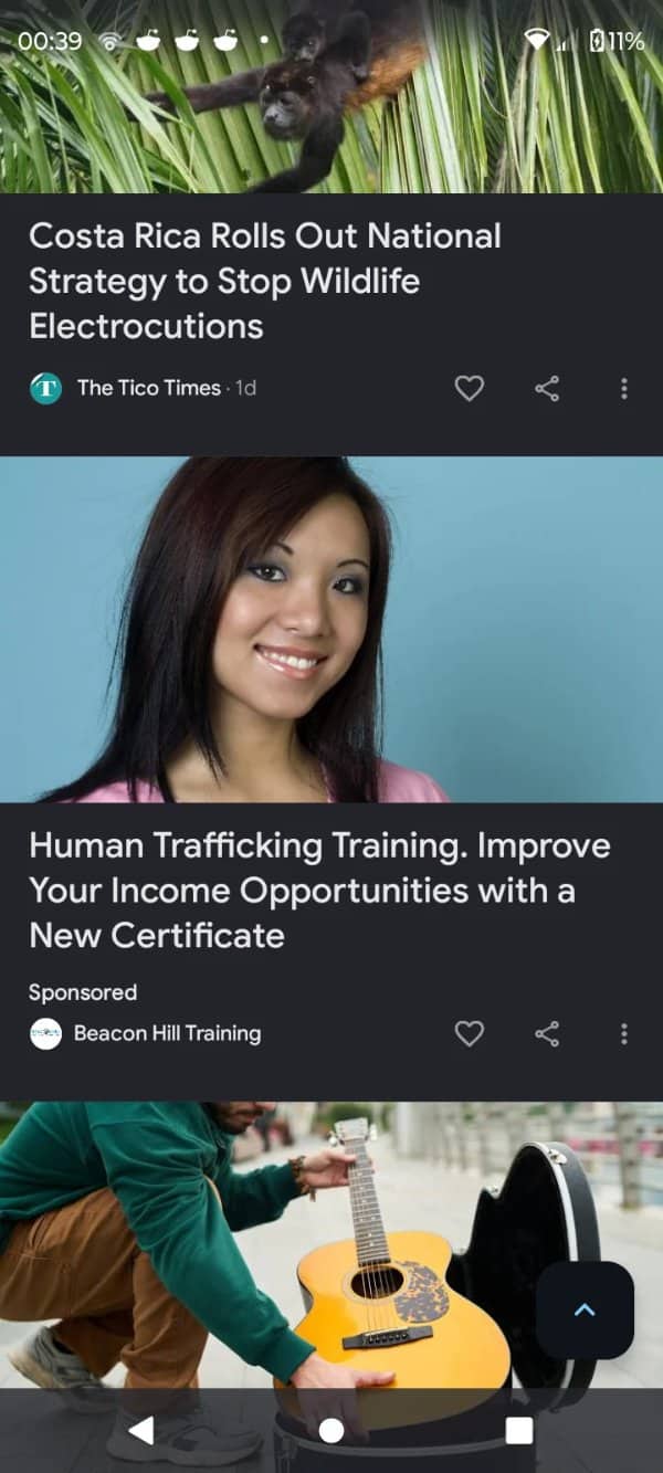 An unfortunate mobile news feed layout positioning a human trafficking ad under a monkey article.