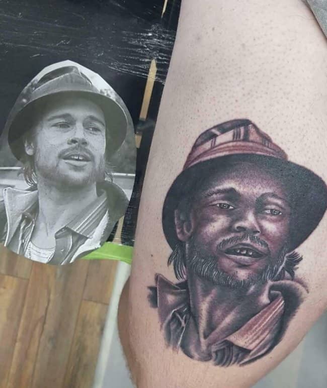Portrait reference of Brad Pitt in a bucket hat compared to a dark, distorted realistic arm tattoo.