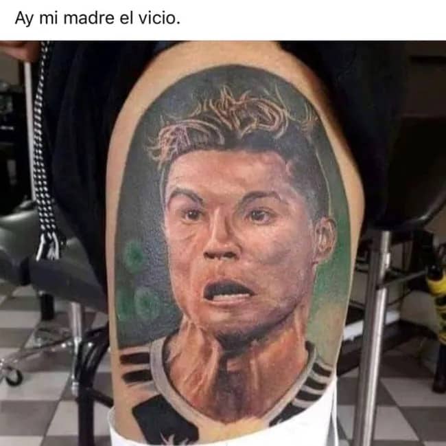 A questionable portrait tattoo of soccer star Cristiano Ronaldo on a person's thigh with text.