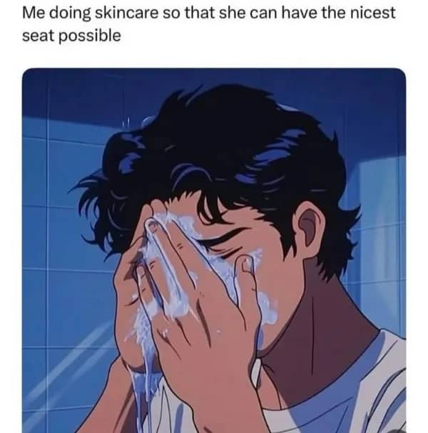 Anime style illustration of a young man washing his face in a blue bathroom setting.