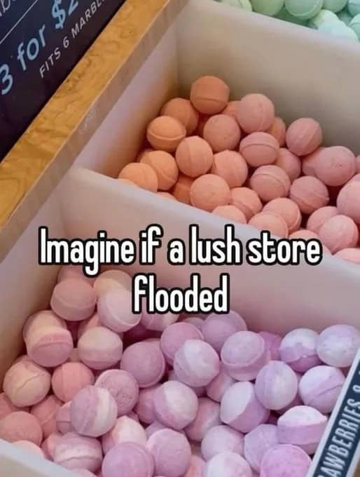 Close up of colorful round bath bombs in a display bin with flooding text.