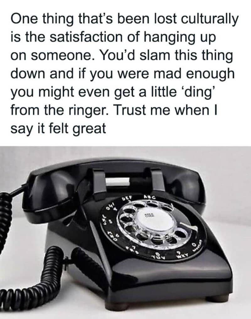 Vintage black rotary telephone on white surface with meme text about slamming the receiver down.