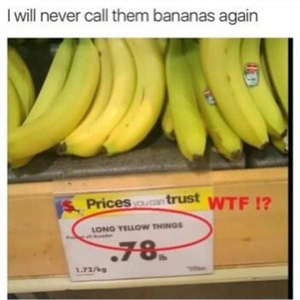 Grocery store price tag label reading Long Yellow Things under a bunch of bananas.