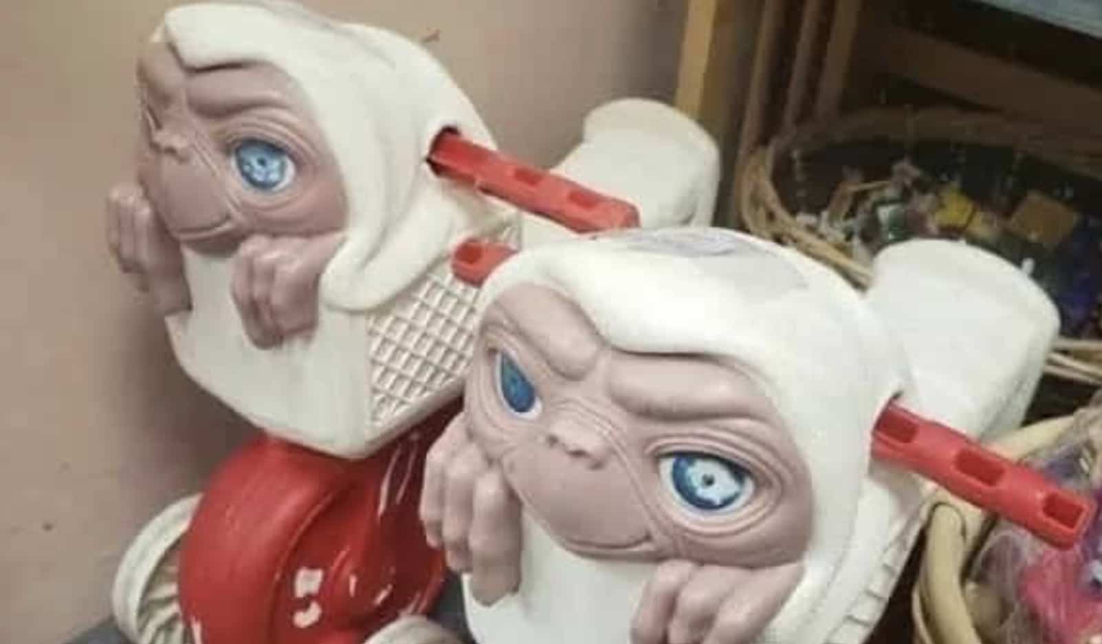 Funny memes showing strange ET alien head rocking horse rides in a store.