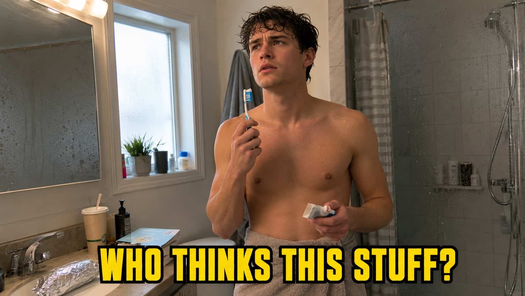 Shirtless young man brushing teeth in bathroom with confused expression, illustrating funny shower thoughts.