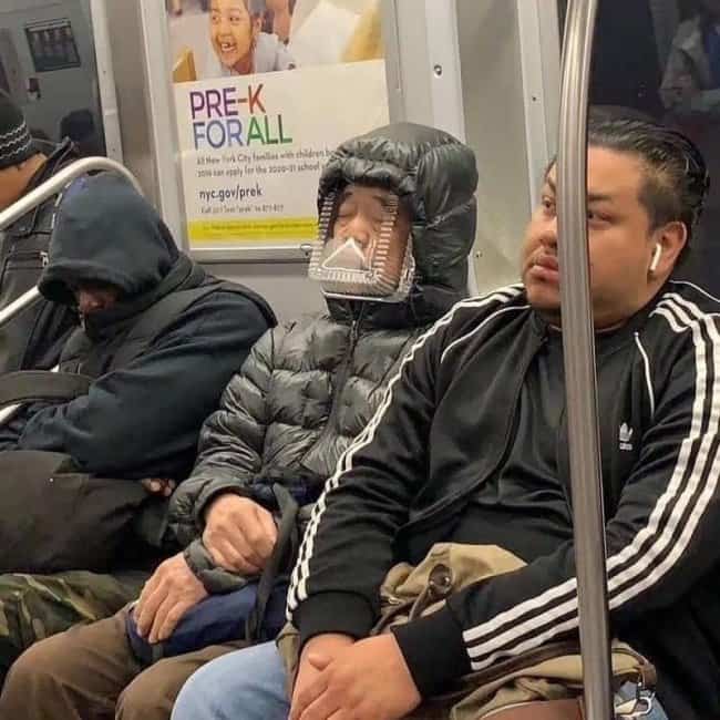 Subway commuter wearing a clear plastic food container strapped over his face for funny public transit memes.