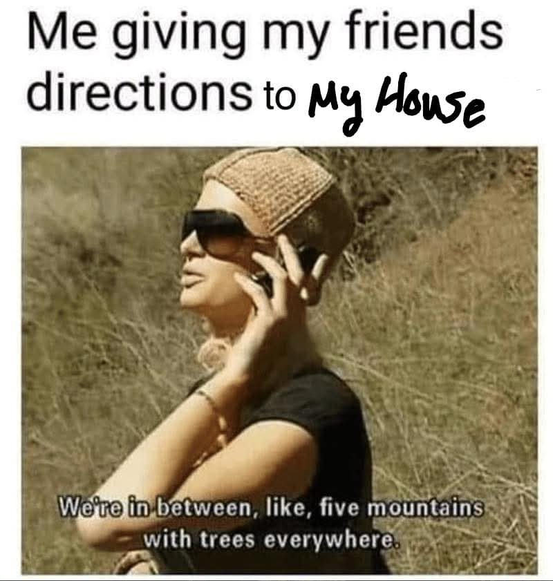 hilarious classic meme captures a screenshot of Paris Hilton from The Simple Life holding a flip phone to her ear in a dry, brushy landscape. She is wearing large designer sunglasses and a knit cap, with the subtitle reading, "We're in between, like, five mountains with trees everywhere." The top text layer reads, "Me giving my friends directions to My House," where "My House" is scribbled over by hand.