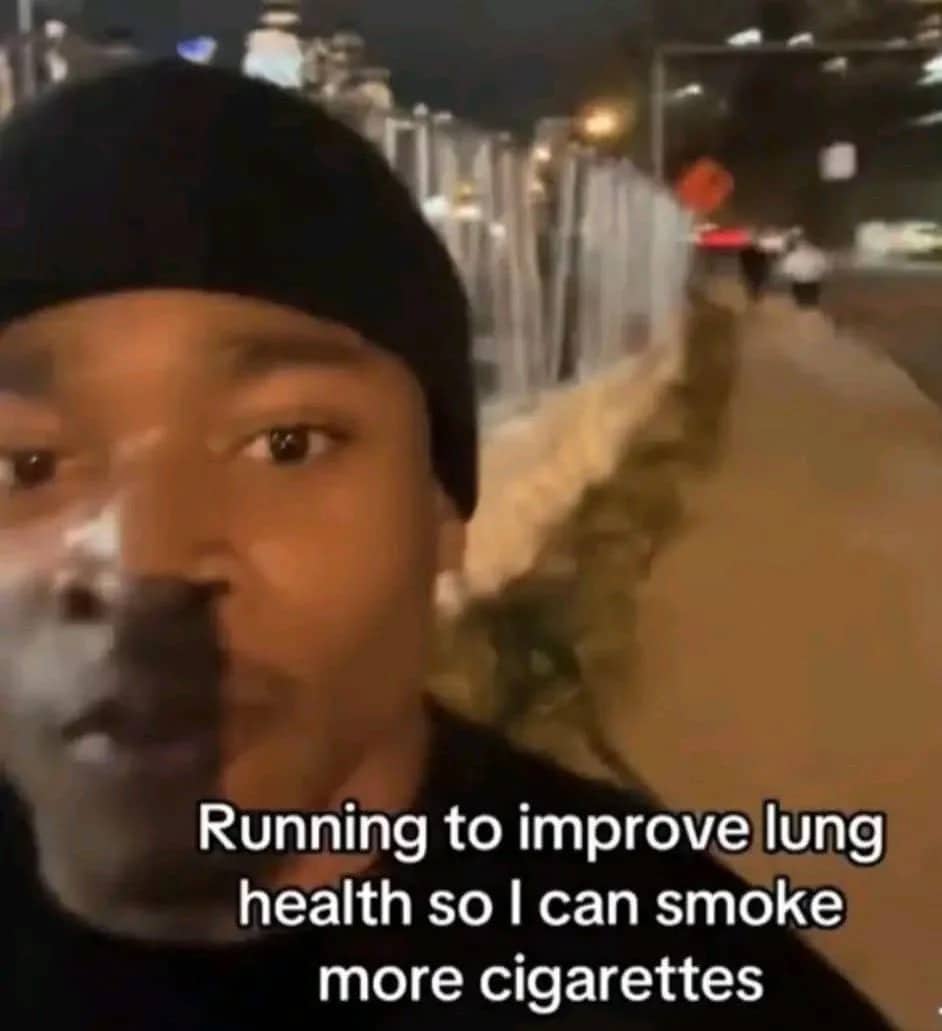 Close-up of a man running outside at night with a funny caption about improving lung health.