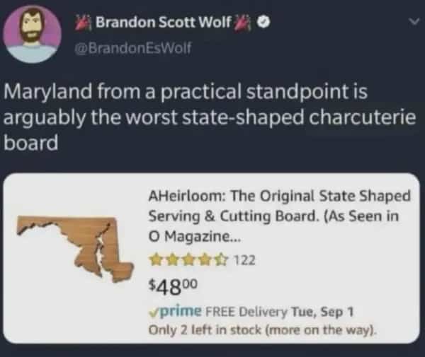Funny memes tweet critiquing a Maryland state shaped cutting board as an impractical charcuterie platter.