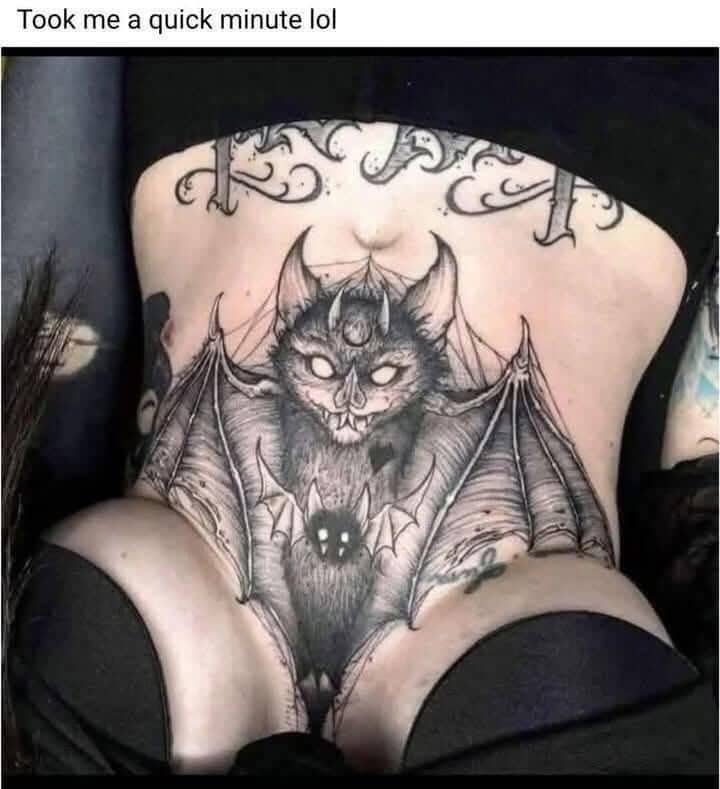 Close-up photograph of a detailed bat tattoo design spanning a person's lower stomach and pelvic region.