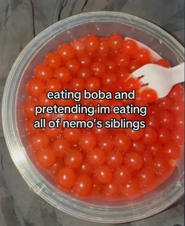 Large bowl filled with orange popping boba pearls and a joke about Nemo's siblings.