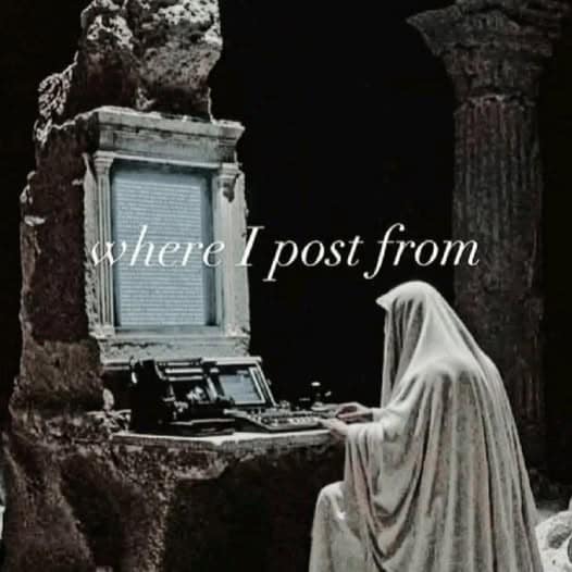 An atmospheric gothic format in our meme dump showing a hooded figure in white robes typing away on a retro computer terminal inside ancient stone ruins, titled "where I post from."