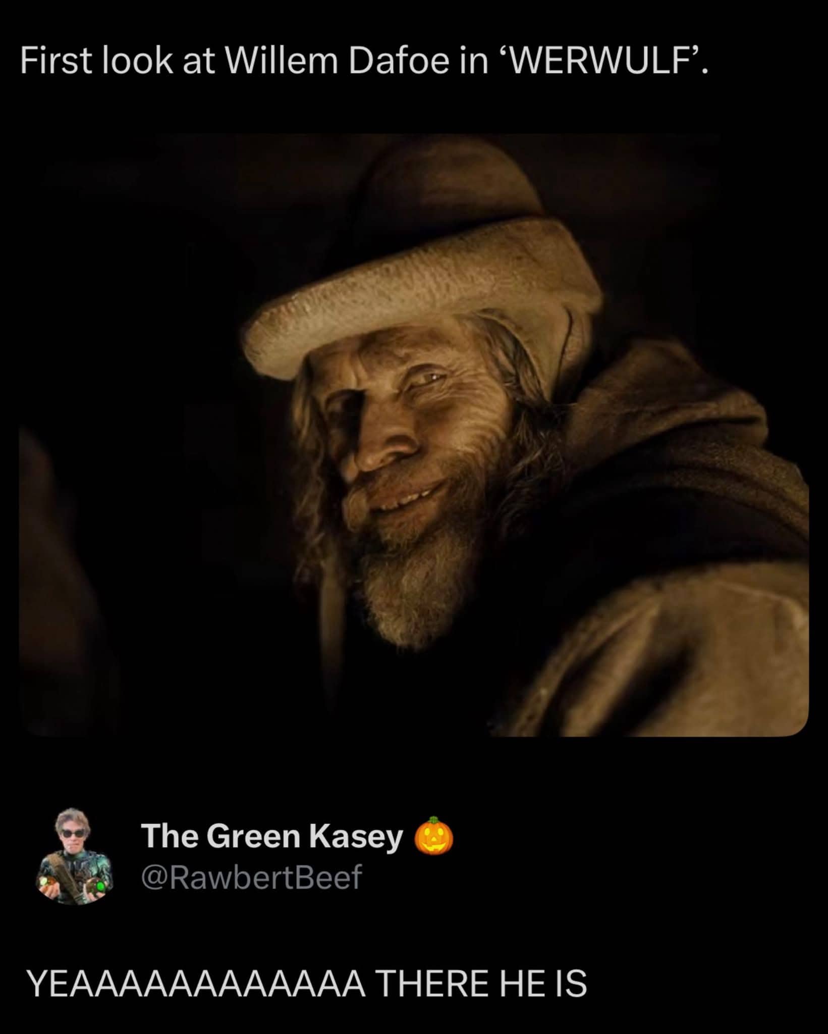 Still of Willem Dafoe looking menacing in a hat and beard from a movie preview.